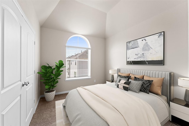 carpeted bedroom featuring baseboards and lofted ceiling