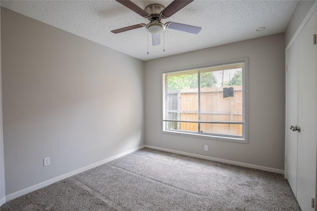 11306 Chiselhurst Way Ct, Houston, TX 77065 - empty room featuring baseboards, carpet flooring, a textured ceiling, and a ceiling fan