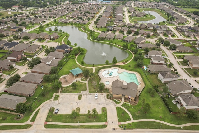 birds eye view of property featuring a water view and a residential view