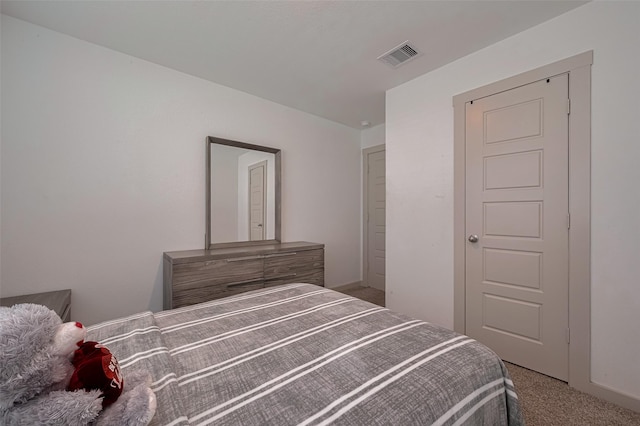 bedroom with carpet flooring and visible vents