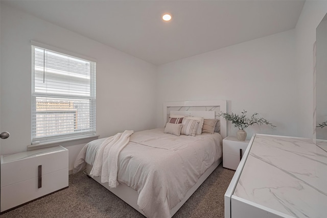 carpeted bedroom with multiple windows