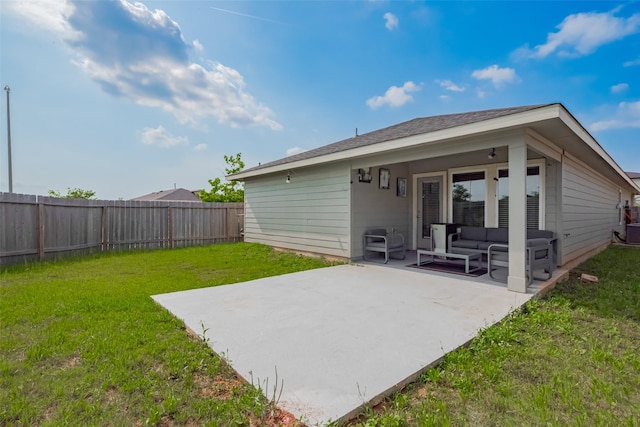 rear view of house featuring a patio, a fenced backyard, a lawn, and an outdoor hangout area