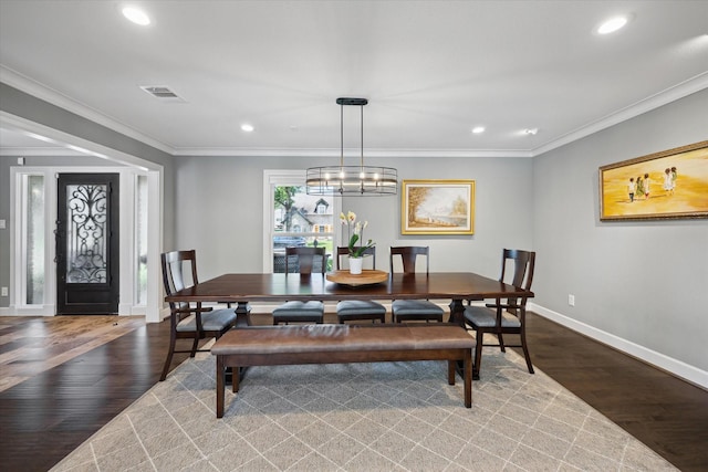 dining space featuring recessed lighting, visible vents, ornamental molding, and wood finished floors