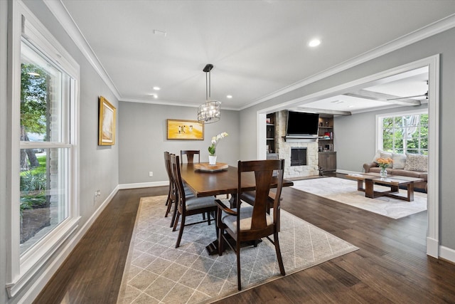 dining room featuring recessed lighting, baseboards, a fireplace, and dark wood finished floors