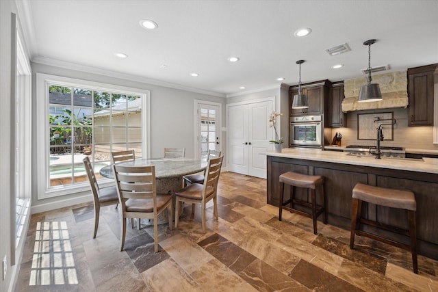 dining space with crown molding, recessed lighting, and visible vents