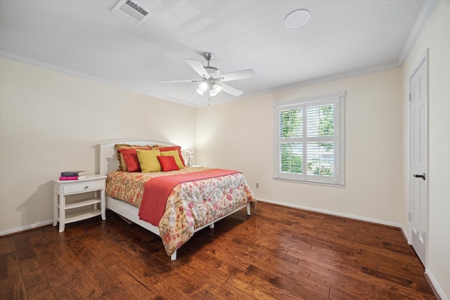 bedroom with a ceiling fan, baseboards, wood finished floors, visible vents, and ornamental molding