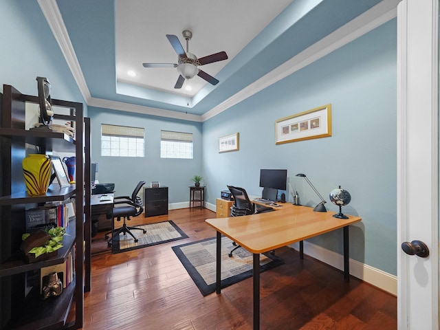 office with baseboards, a ceiling fan, wood finished floors, and a tray ceiling