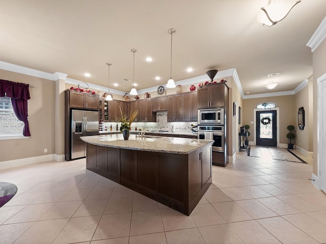 kitchen featuring light stone countertops, stainless steel appliances, baseboards, light tile patterned floors, and ornamental molding