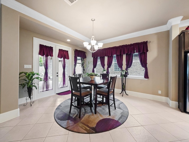 dining space with light tile patterned floors, an inviting chandelier, and a wealth of natural light