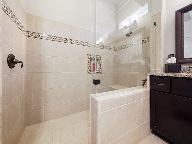 full bath with vanity, crown molding, and walk in shower
