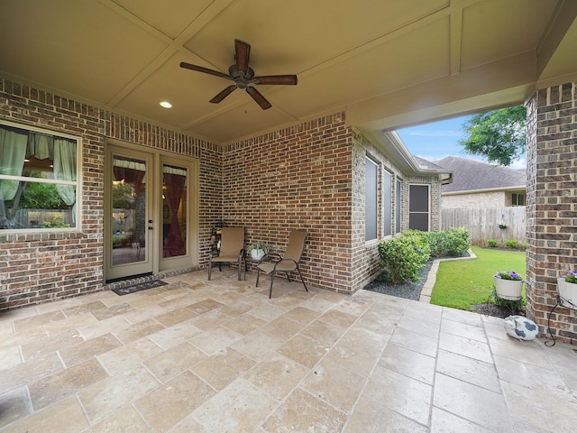 view of patio with fence and ceiling fan