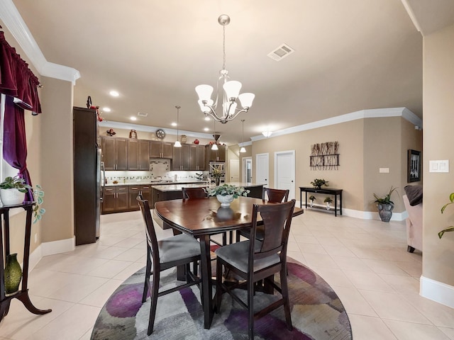 dining space featuring light tile patterned floors, baseboards, a notable chandelier, and visible vents