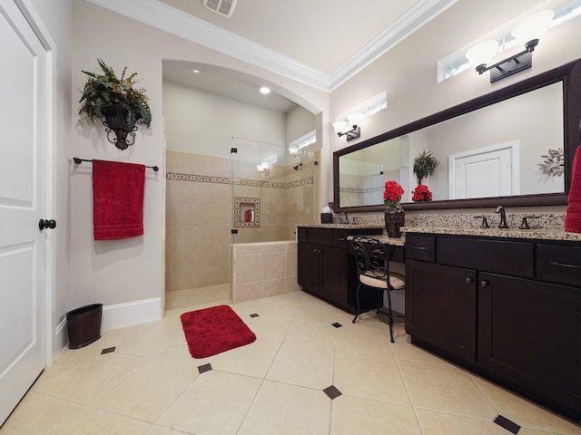 full bath with a walk in shower, tile patterned floors, ornamental molding, and vanity