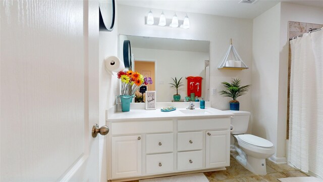 22523 Strathmore Dr, Richmond, TX 77469 - bathroom featuring tile patterned floors, toilet, visible vents, and vanity