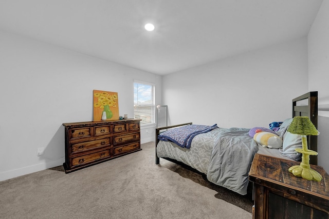 9911 Silverling Ct, Conroe, TX 77385 - carpeted bedroom featuring baseboards