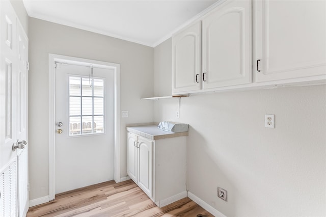 washroom featuring baseboards, hookup for an electric dryer, laundry area, and light wood-style flooring