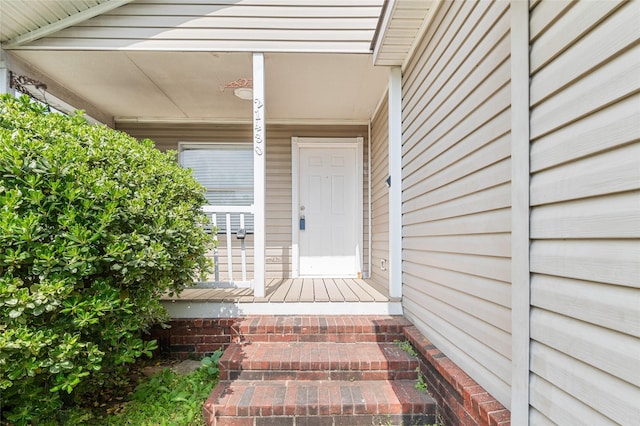 doorway to property featuring a porch