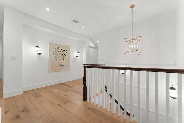 2530 Stanmore Dr, Houston, TX 77019 - corridor with an upstairs landing, light wood-style flooring, baseboards, a chandelier, and recessed lighting