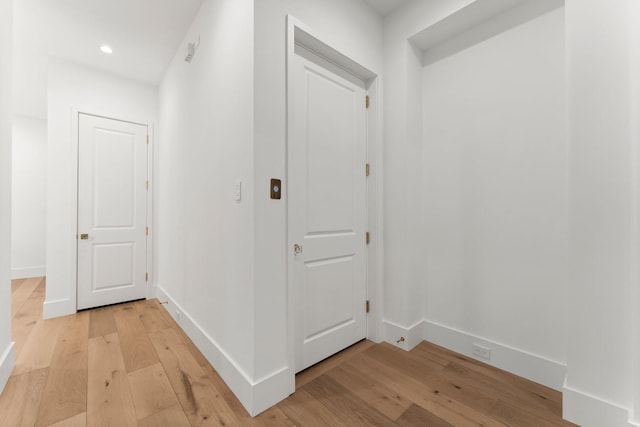 2530 Stanmore Dr, Houston, TX 77019 - hall with light wood finished floors, baseboards, and recessed lighting