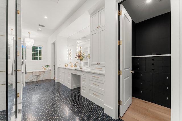 2530 Stanmore Dr, Houston, TX 77019 - full bath featuring vanity, a garden tub, and recessed lighting