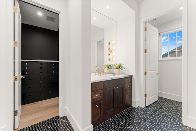 2530 Stanmore Dr, Houston, TX 77019 - bathroom featuring vanity, baseboards, and recessed lighting