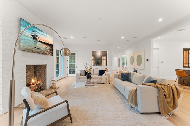 2530 Stanmore Dr, Houston, TX 77019 - living area with a brick fireplace, wood finished floors, recessed lighting, and healthy amount of natural light