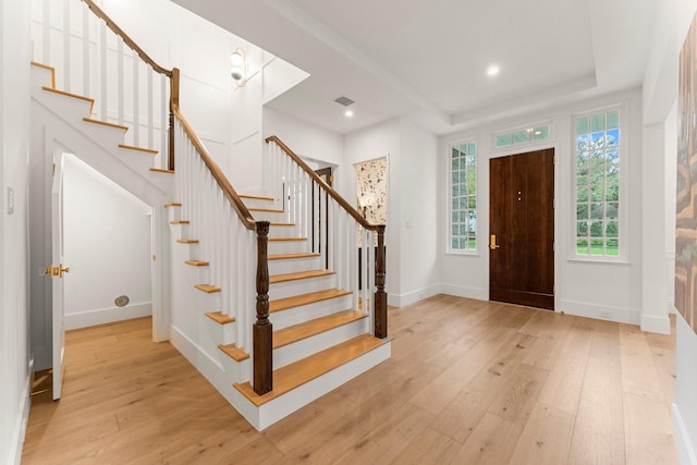 2530 Stanmore Dr, Houston, TX 77019 - foyer featuring wood-type flooring, stairs, a raised ceiling, baseboards, and recessed lighting