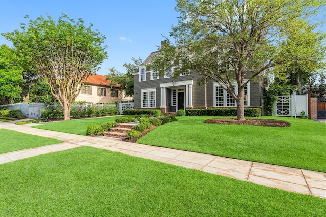 2530 Stanmore Dr, Houston, TX 77019 - colonial-style house featuring a gate
