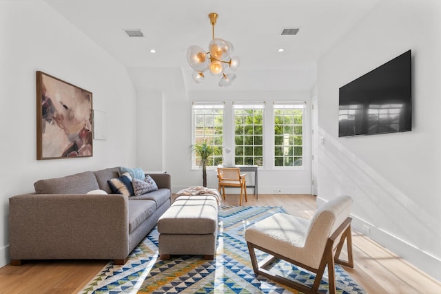 2530 Stanmore Dr, Houston, TX 77019 - living room featuring light wood-type flooring, a chandelier, baseboards, and vaulted ceiling