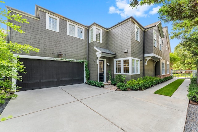 2530 Stanmore Dr, Houston, TX 77019 - view of front facade featuring a garage and concrete driveway