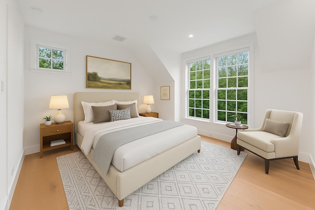 2530 Stanmore Dr, Houston, TX 77019 - bedroom with multiple windows, light wood-style floors, baseboards, and recessed lighting
