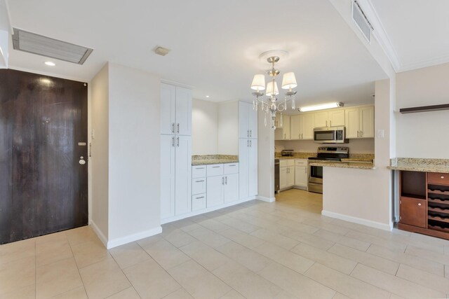 kitchen featuring appliances with stainless steel finishes, a notable chandelier, recessed lighting, and visible vents