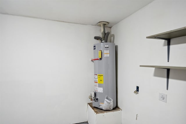 utility room featuring water heater