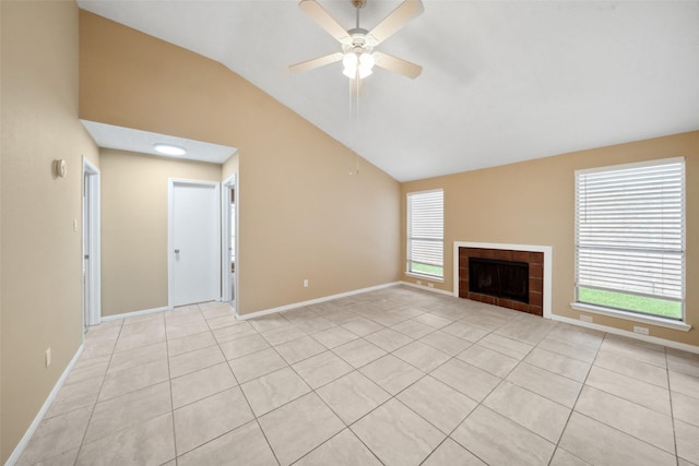 unfurnished living room featuring baseboards, ceiling fan, lofted ceiling, and a healthy amount of sunlight