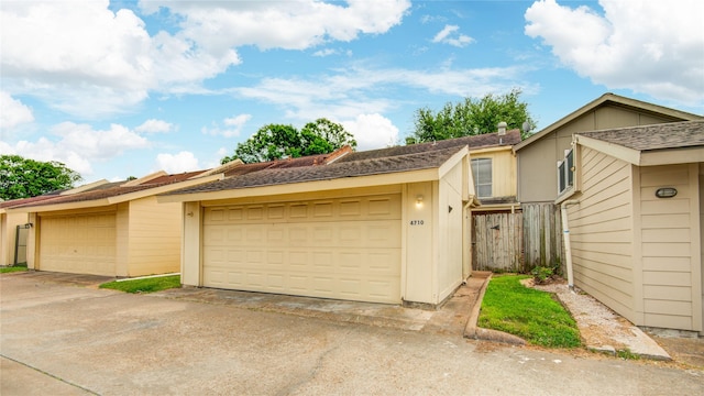 multi unit property featuring a detached garage