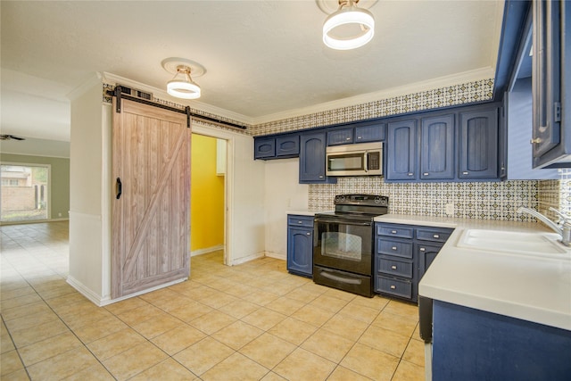 kitchen featuring electric range, a barn door, light countertops, stainless steel microwave, and a sink