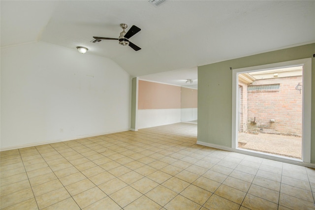 empty room featuring ceiling fan, tile patterned floors, and lofted ceiling