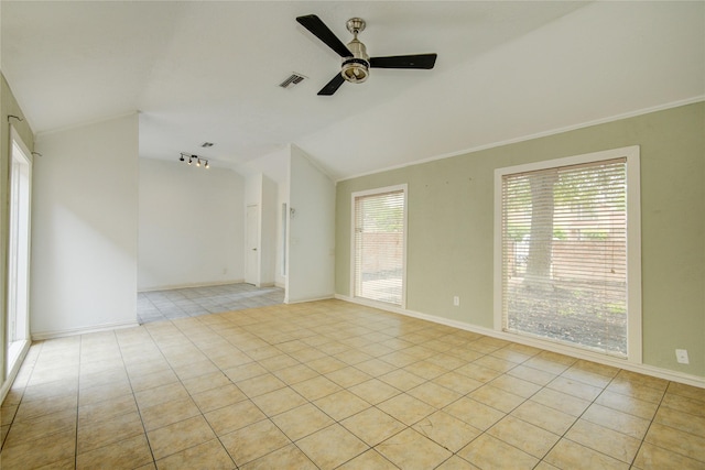 empty room featuring light tile patterned flooring, ceiling fan, vaulted ceiling, and visible vents