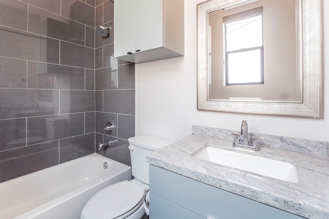 full bath featuring toilet, washtub / shower combination, and vanity