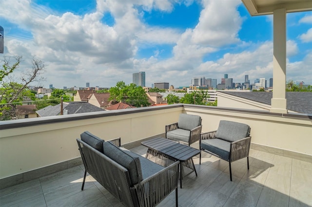view of patio featuring a city view and a balcony