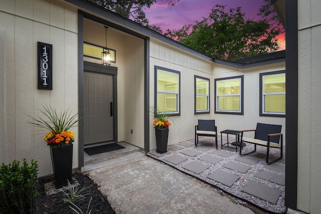entrance to property featuring a patio area