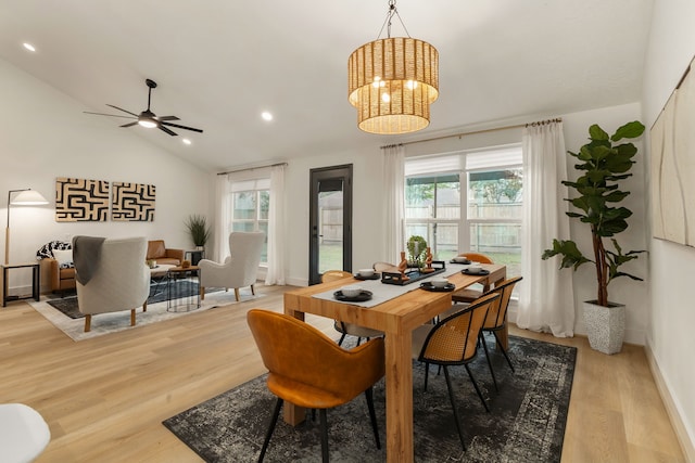 dining space with a healthy amount of sunlight, recessed lighting, light wood finished floors, and lofted ceiling