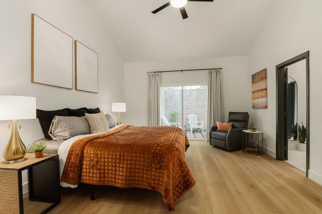bedroom with ceiling fan, light wood finished floors, access to exterior, baseboards, and vaulted ceiling