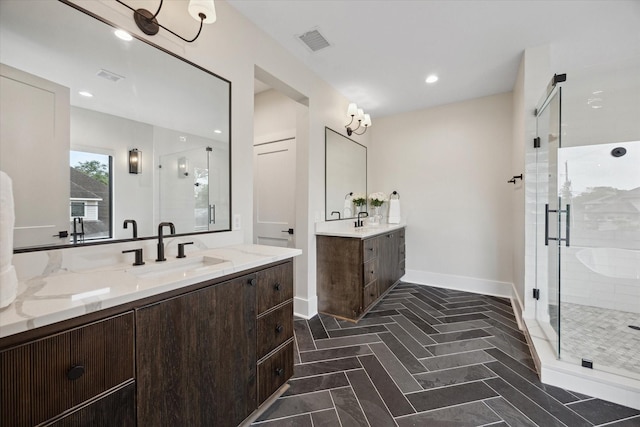 bathroom featuring visible vents, a sink, and a stall shower