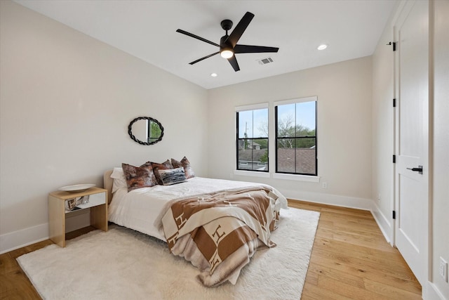 bedroom with ceiling fan, light wood-style flooring, recessed lighting, baseboards, and visible vents