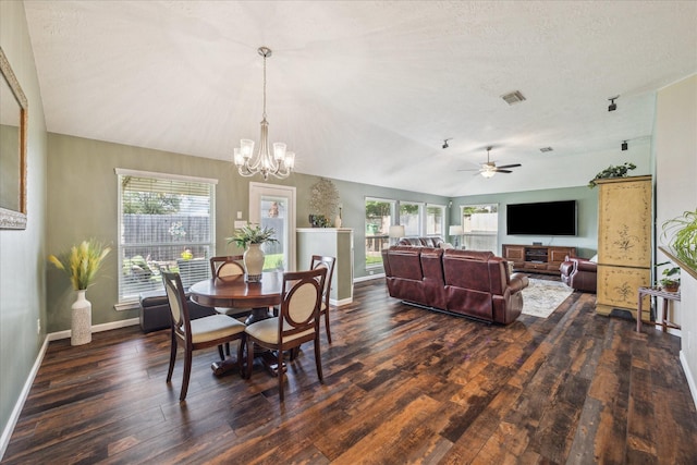 dining room with dark wood-type flooring, baseboards, ceiling fan with notable chandelier, and visible vents
