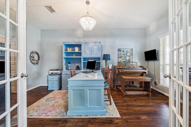 office space with visible vents, dark wood-type flooring, a chandelier, french doors, and a wealth of natural light