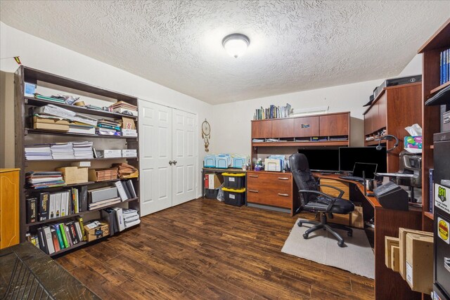 home office featuring a textured ceiling and wood finished floors