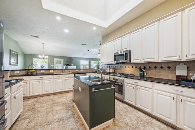 kitchen featuring backsplash, recessed lighting, appliances with stainless steel finishes, and a sink