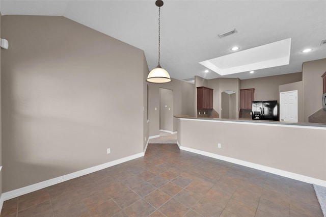 kitchen featuring black fridge, recessed lighting, baseboards, a skylight, and visible vents